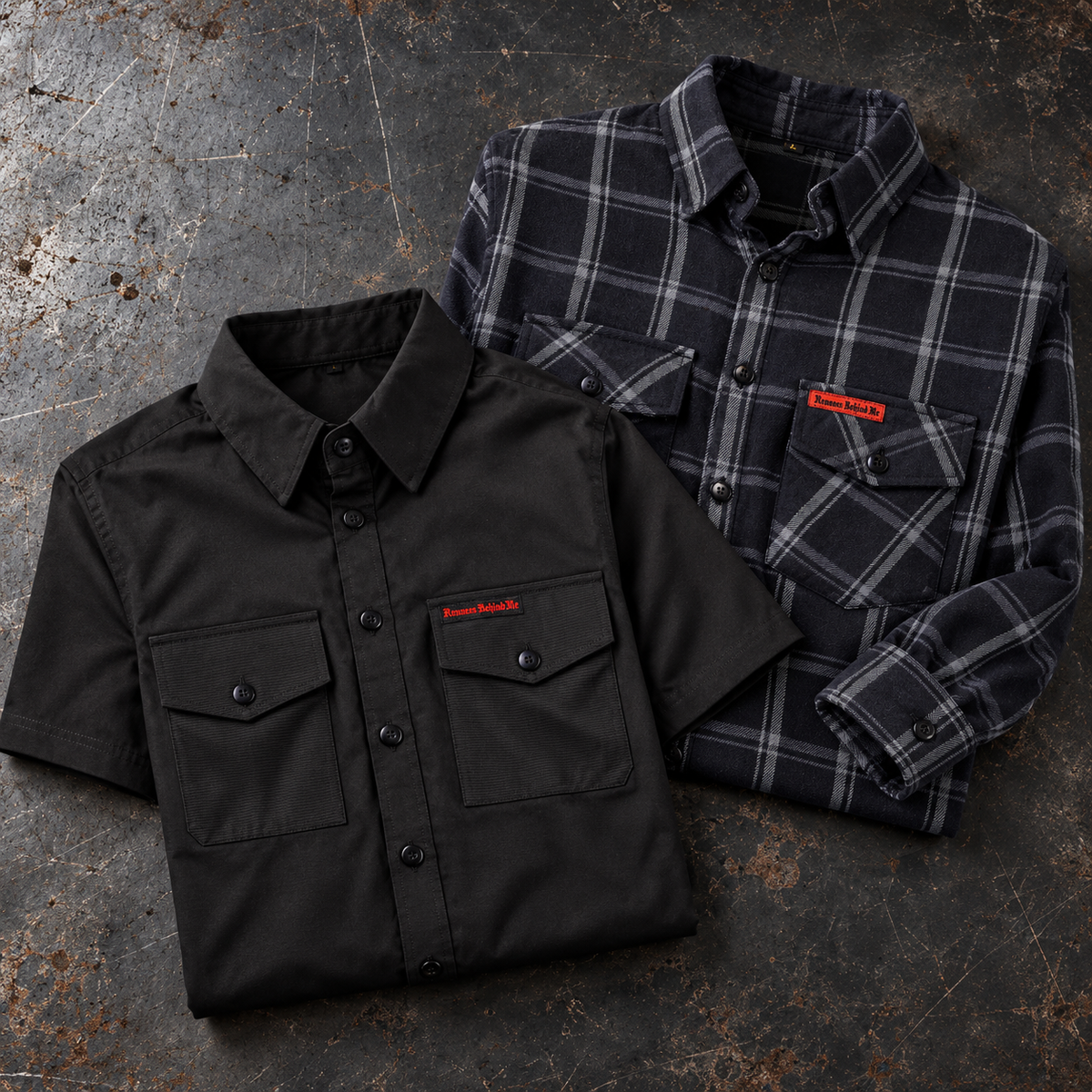 Black short-sleeve shop shirt and black-and-gray plaid flannel folded on a workshop bench
