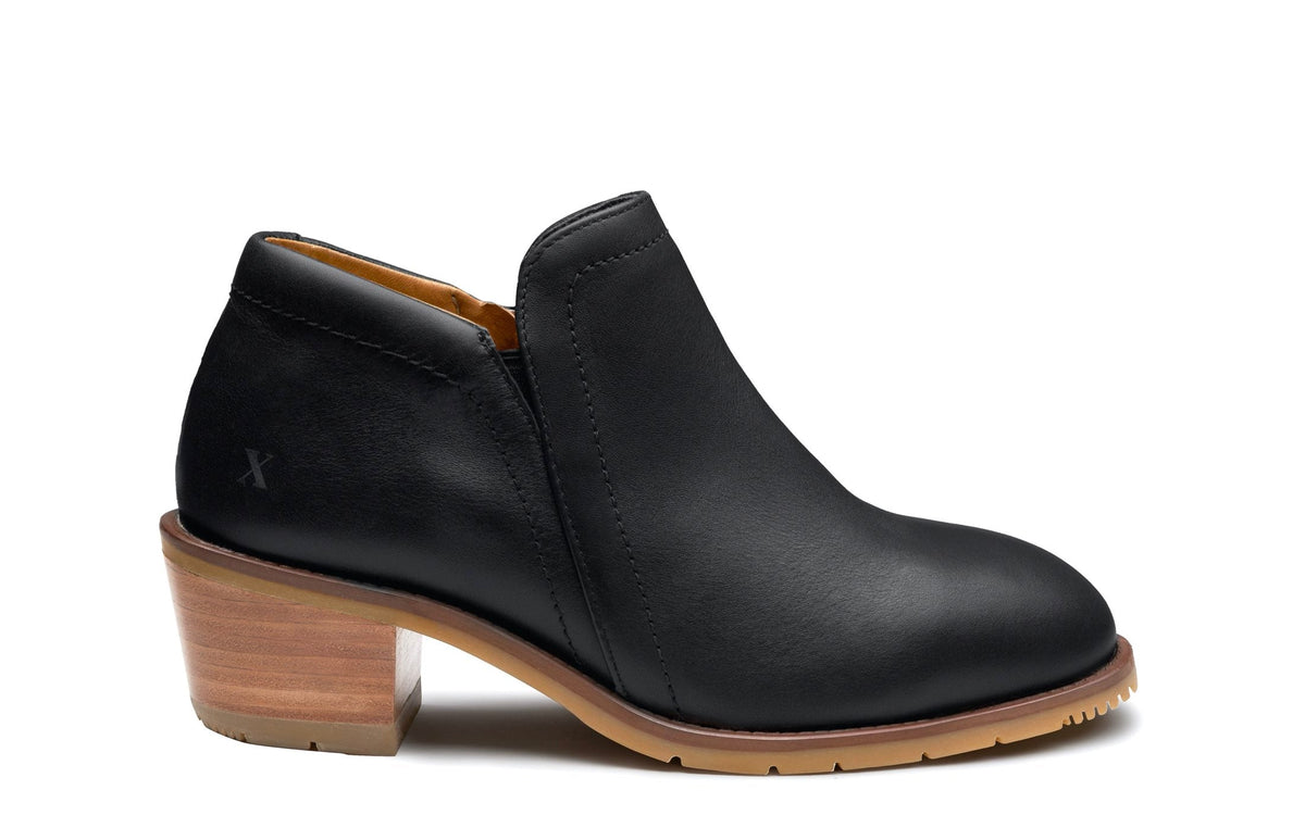 Xena Gravity women’s steel toe work booties in Sleek Black — side profile